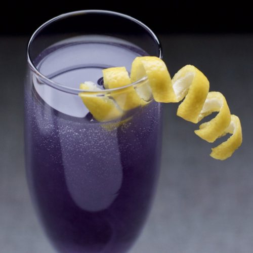 The Violette 75 Gin Cocktail with Lemon Twist